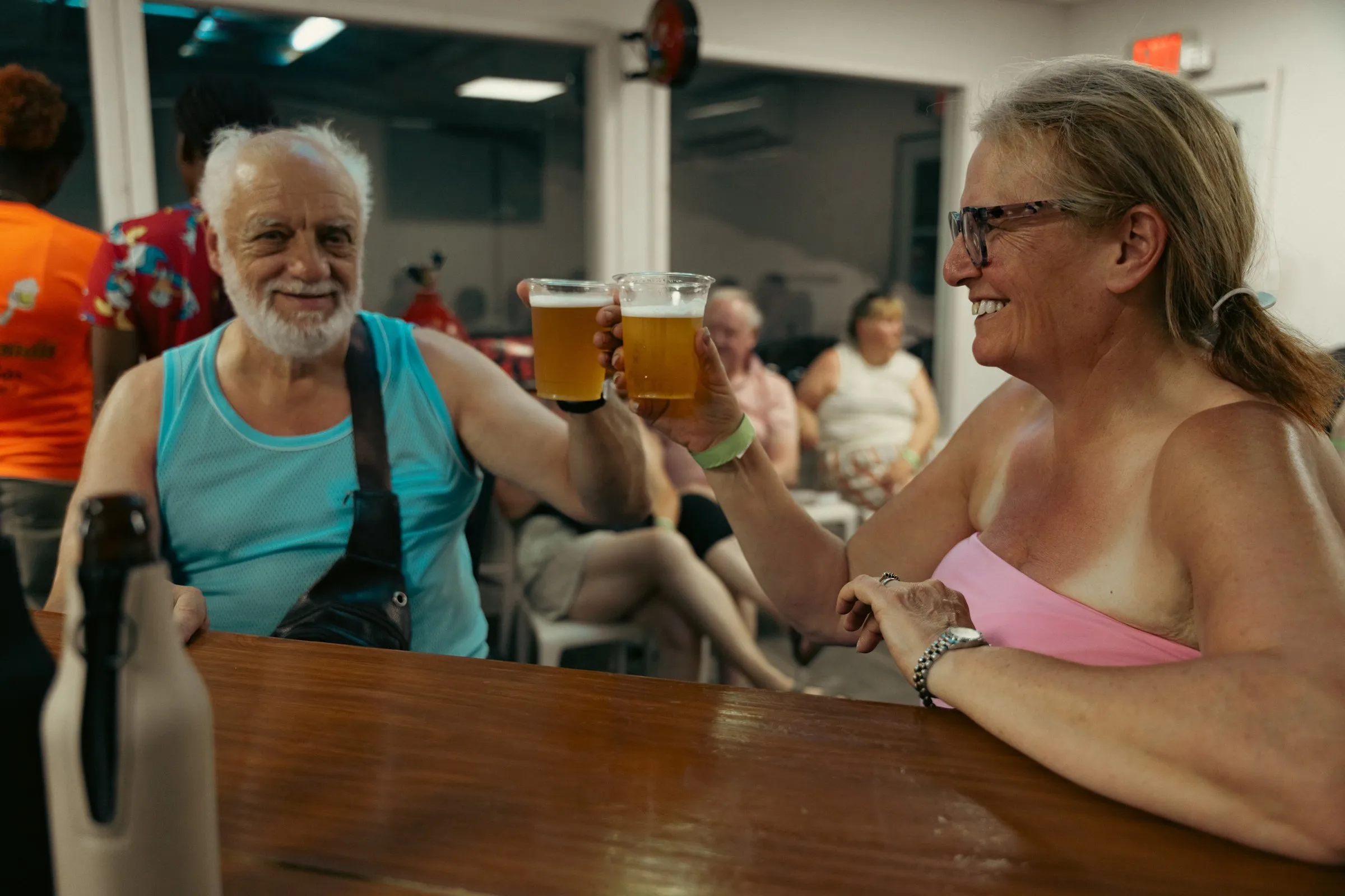 Guests raising their glasses at the taproom bar